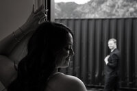 Black and white first look moment of the groom turning to see the bride during their wedding at Marchand Ranch in Colorado.