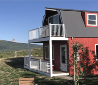 Two story cabin near East Glacier, or Babb, MT, is ready for your Glacier NP Elopement. Sit on the top balcony and watch the sunset over the Rockies.