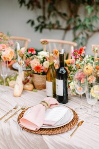 Table decorations, candles, and plates at wedding reception at Veritas Winery
