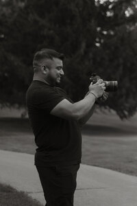 Daniel, associate videographer for Rainstorm Photo & Video, filming during golden hour — capturing the authentic, emotional moments that define the team’s documentary approach.