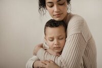Mother cuddling child featured in Michigan photography style guide