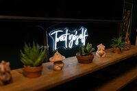 long table with a plant design