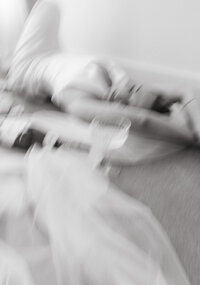 blurry image of bride laying on floor