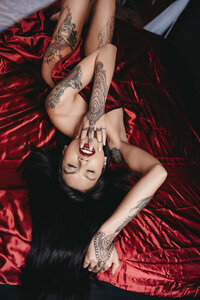 Confident woman posing in luxurious boudoir attire in Minneapolis