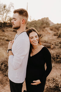 family of 3 posing for classic studio family session in phoenix