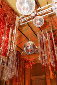 Suspended floral chandelier installation adding drama and elegance to a Dallas wedding reception space.