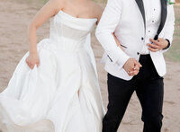 Bride & groom desert sunset pose.