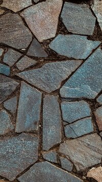 Uneven flagstone patio pavers are arranged in an organic pattern on a walkway in Missoula Montana.