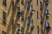 Energy-efficient air conditioning units installed on the exterior of a building in Dublin.
