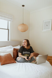 woman posing on bed