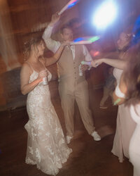 Bride and groom sharing a joyful moment on their wedding day in Spokane, Washington, with a documentary-style photography approach.