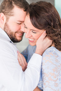 Couple cuddling at engagement session