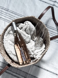 BASKET WITH WINE ON BLANKET photo by AMALYN STYLE + SOCIAL 