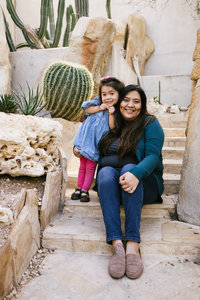 San Antonio Photographer Irene Castillo sitting sitting at the Botanical Garden with her daughter