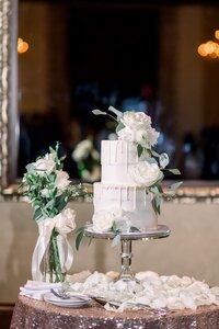 Stunning wedding cake with florals and dripped icing