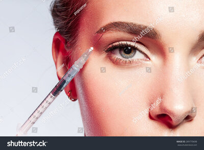 stock-photo--lose-up-of-a-woman-doing-an-injection-under-the-eyebrow-289770698 copy