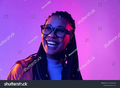 stock-photo-smiling-portrait-of-female-fashion-model-in-cotton-shirt-isolated-on-purple-background-in-neon-2151856201