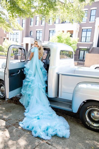 fallback shared on Invalid Date | bride getting into a vintage car in a blue wedding dress