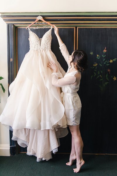 fallback shared on Invalid Date | bay area photographers bride picking up her wedding dress in her bridal suite