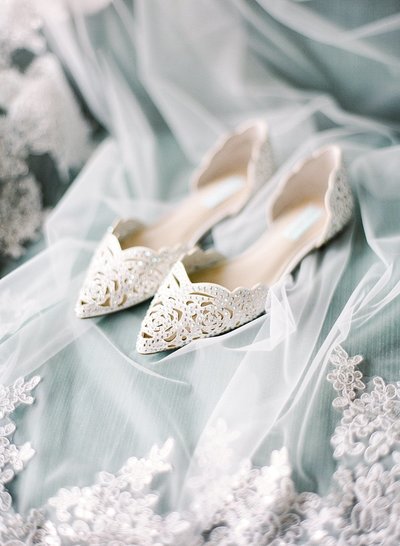 fallback shared on Invalid Date | bay area photographers photographs brides shoes and wedding veil in the bridal suite for...