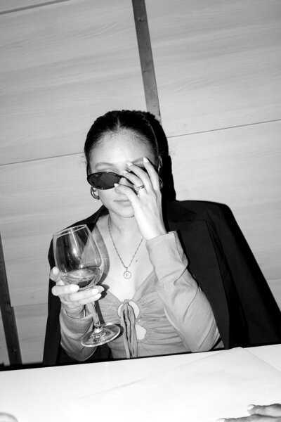 Barcelona-Wedding-Chic-Guest-Enjoying-Wine-Destination-Luxury-Event-Photography-Washington-DC