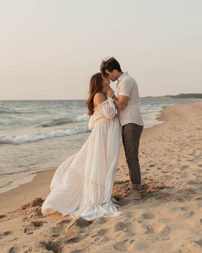 fallback shared on Invalid Date | Couple walking on the beach photographed by a Michigan photography studio