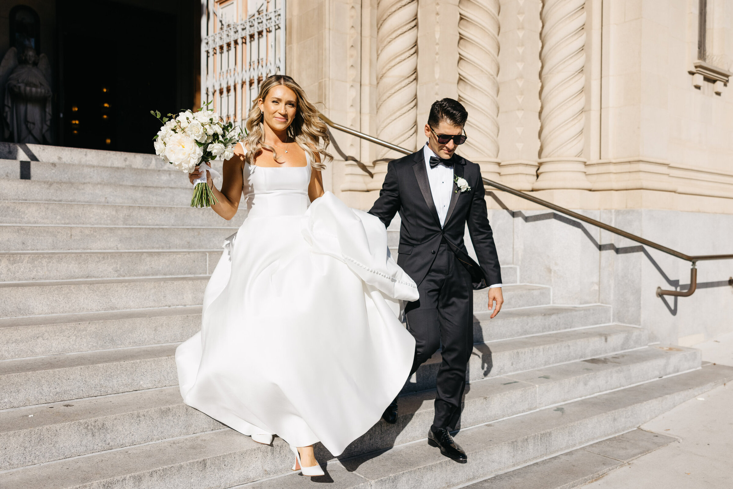 bride and groom leaving church in san francisco after wedding