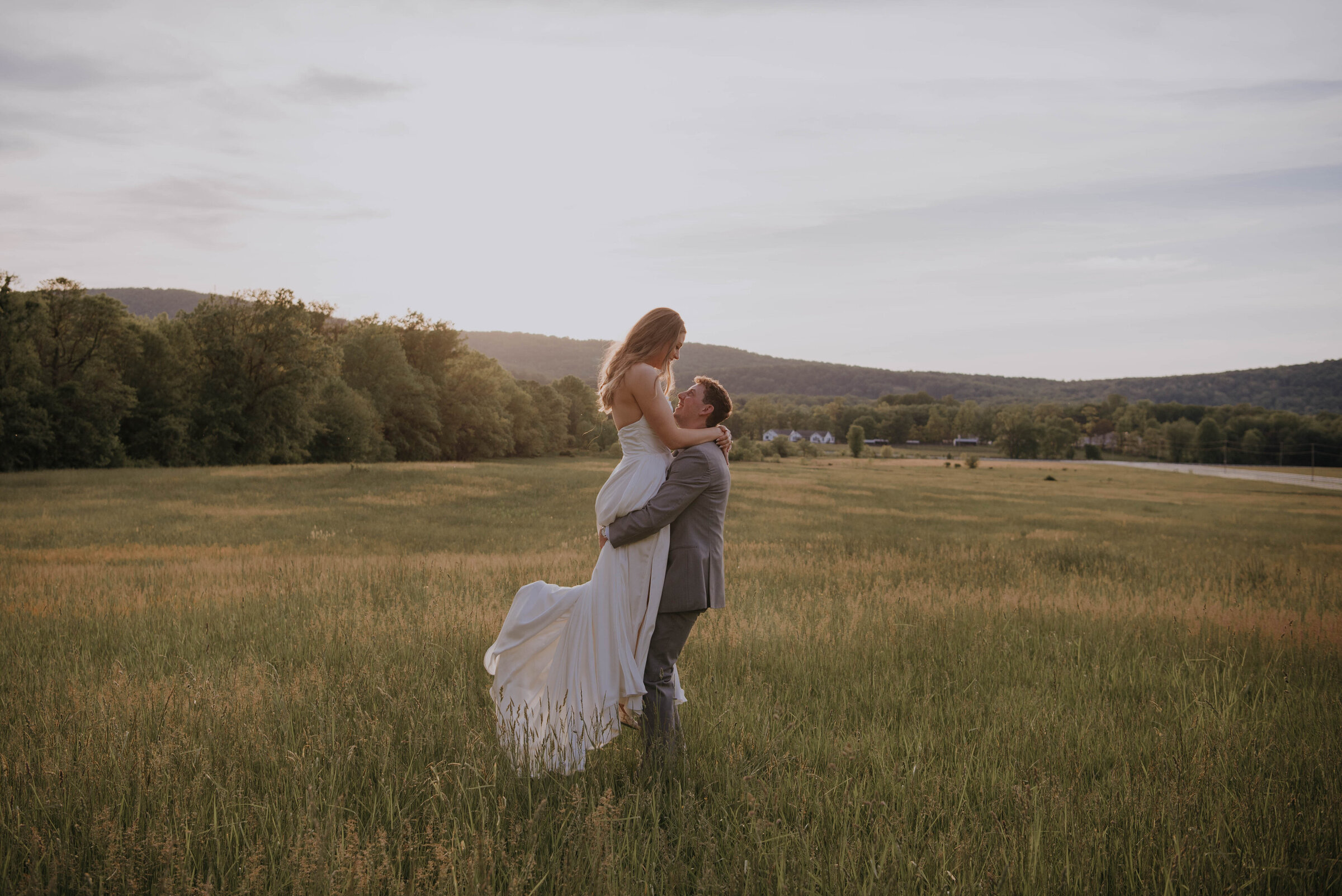 Bride & Groom at field during sunset
