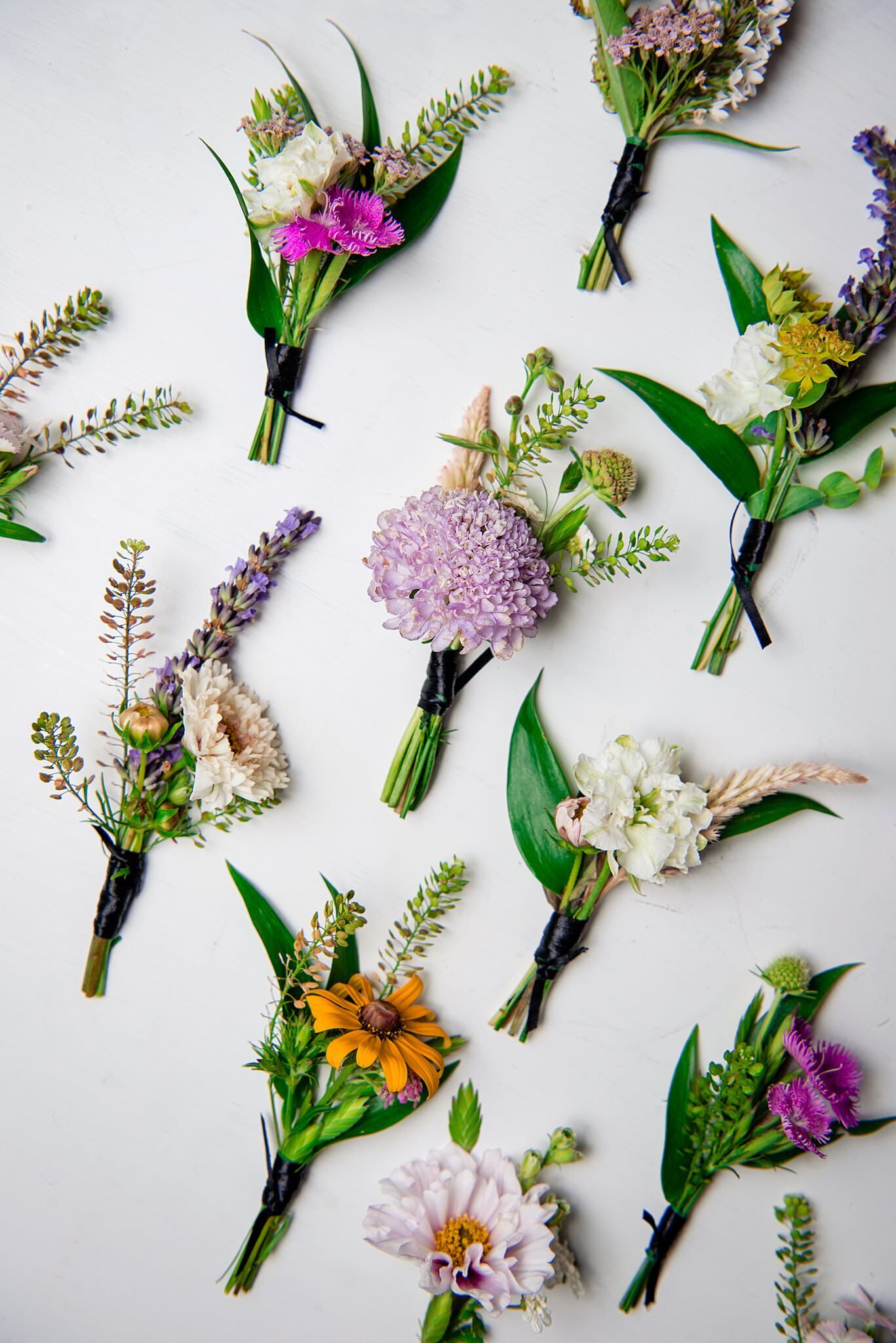 Mixed styles of wildflower boutonnieres