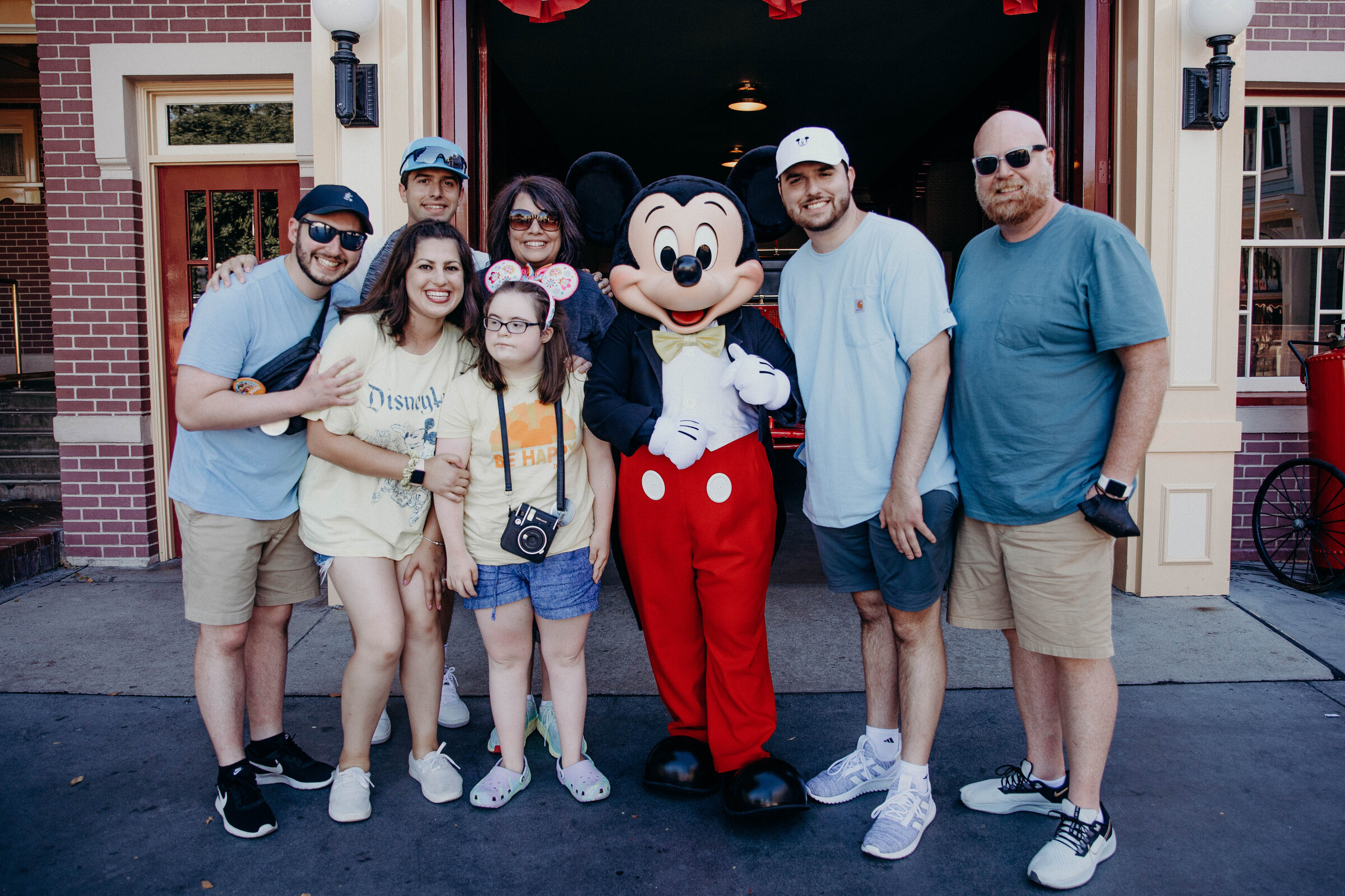 Family poses with Mickey