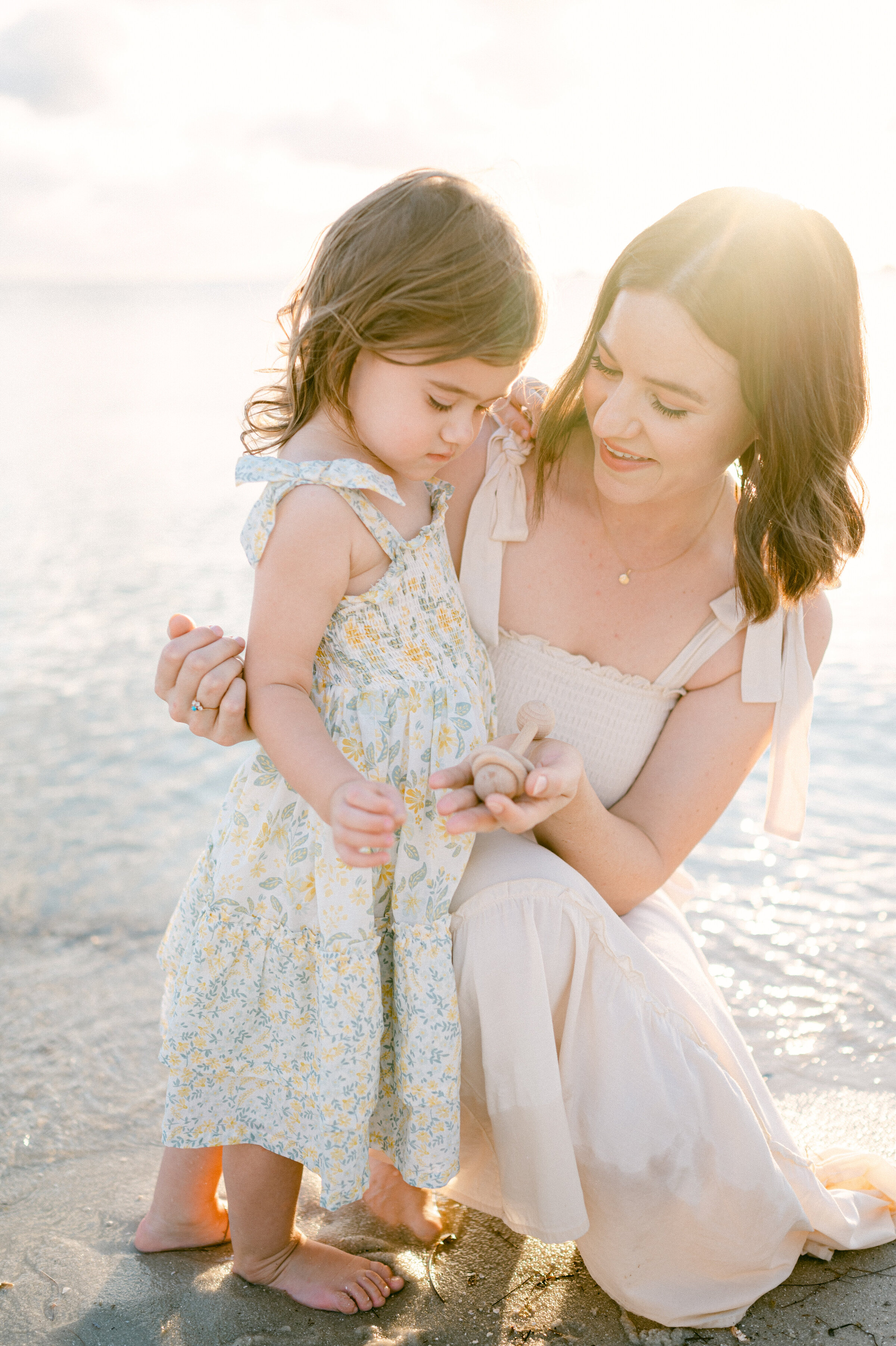 Mom  and daughter at the beach during sunset by Miami Family Photographer