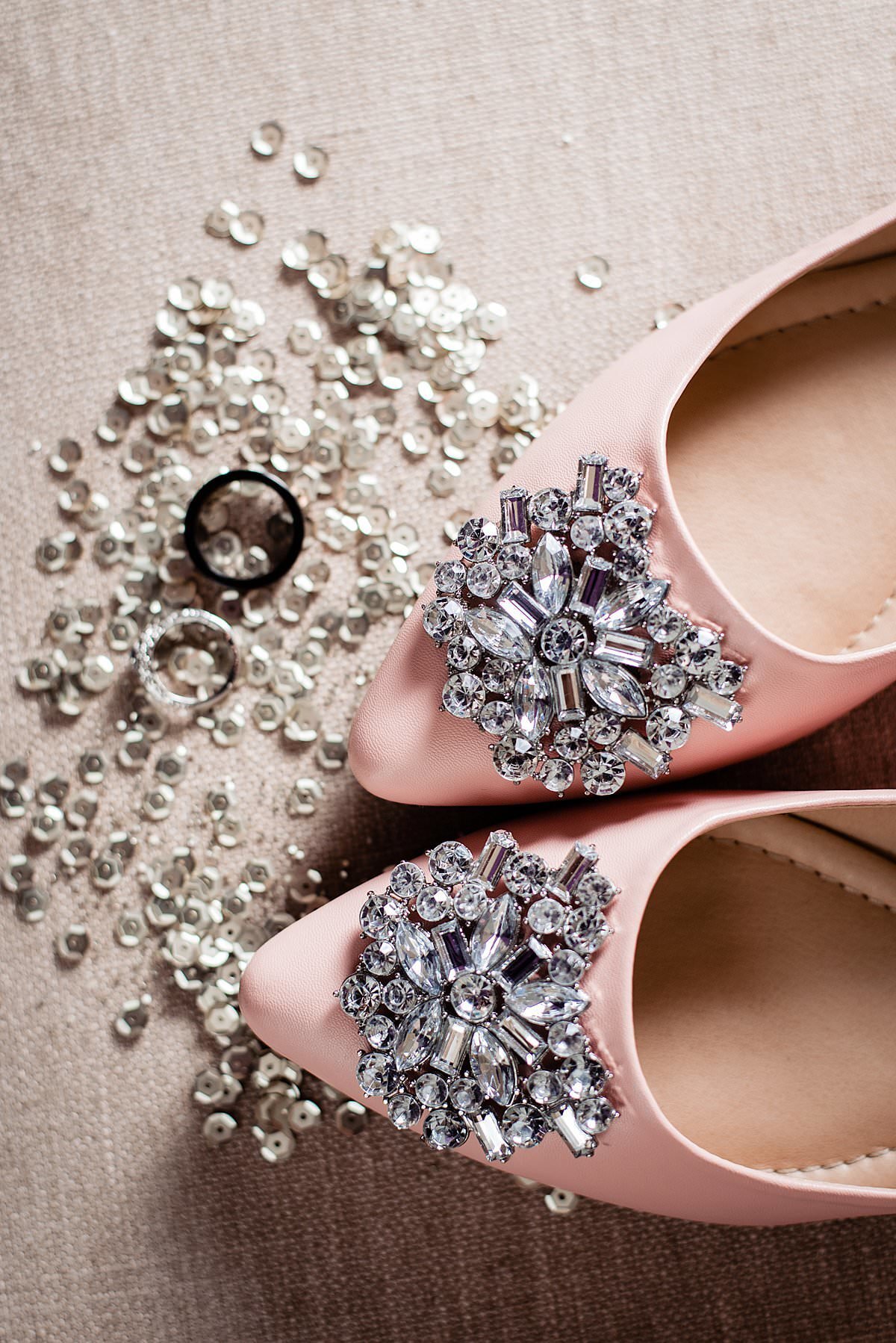 Pink flats with rhinestone detailing on the tops