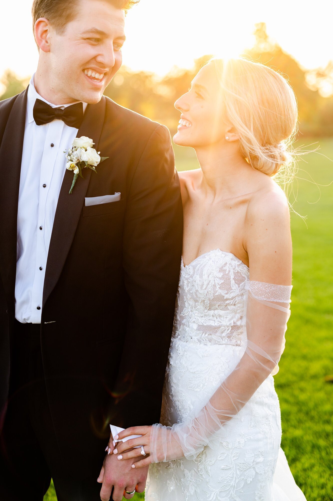 Bride and groom smiling at each other taken by wedding photographer minneapolis by Kacey Wyrick Photography