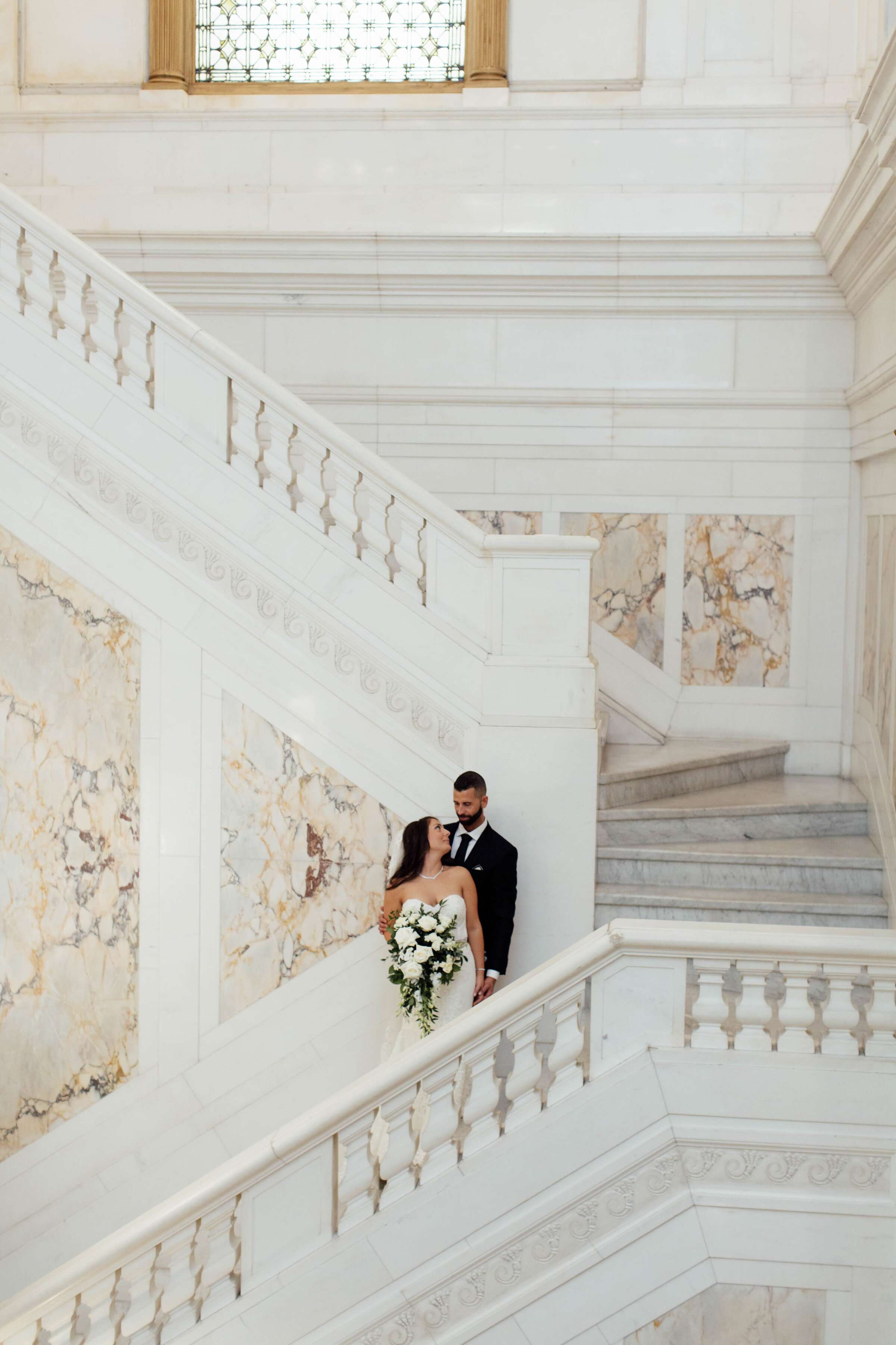 Bride and groom in an embrace after their wedding.
