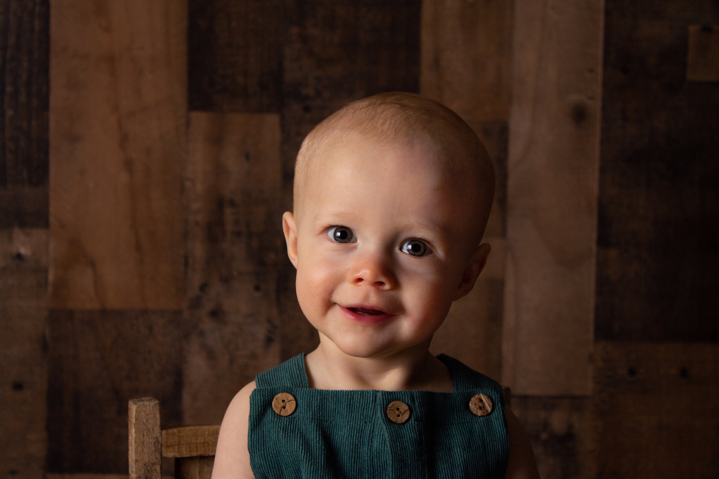 Elliot poses for his milestone pictures with a big smile.