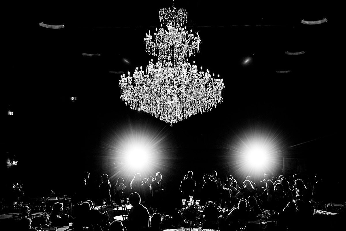 Black and white photo of the Sycamore Farms ballroom dance floor highlighting the crystal chandelier