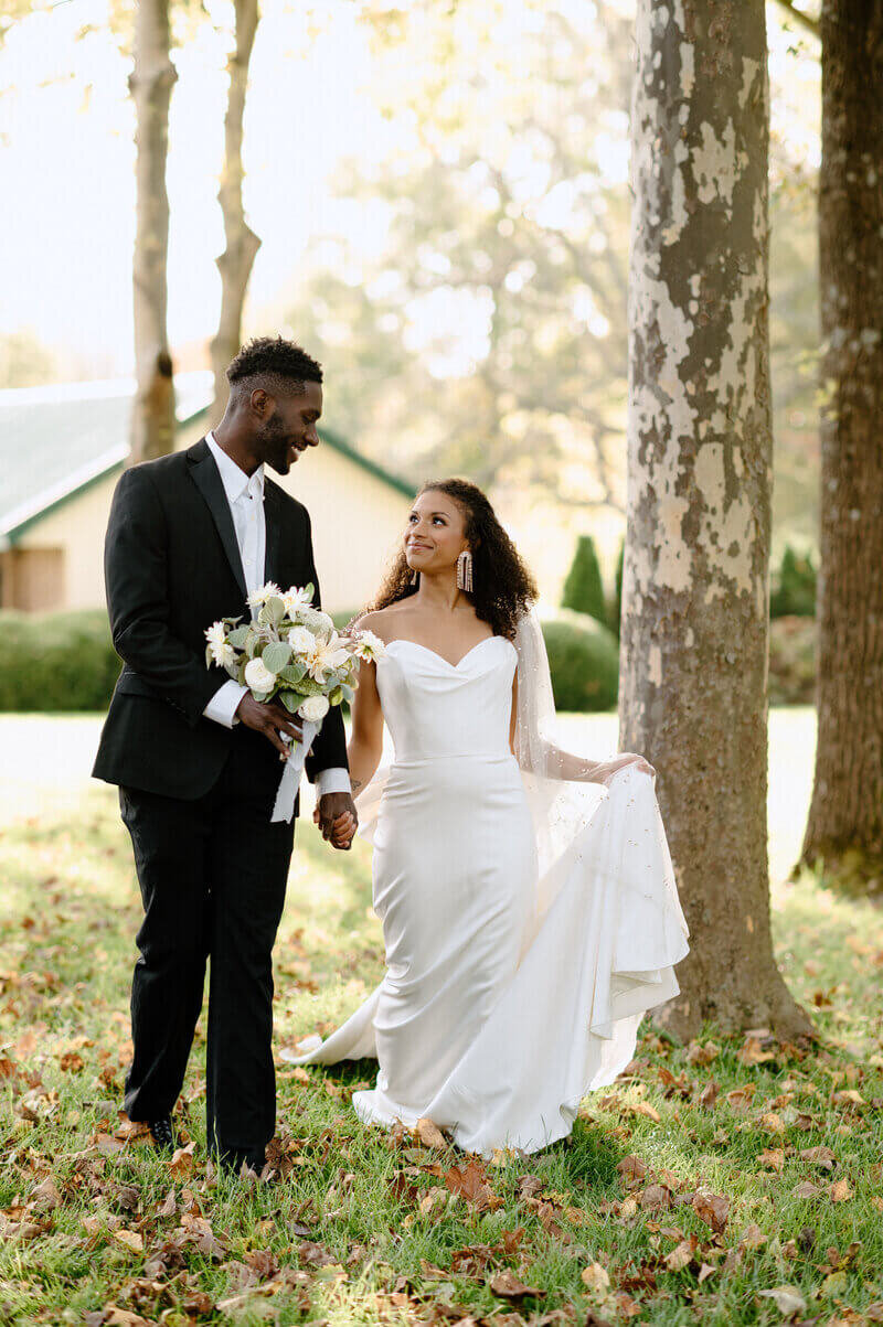 bride and groom looking at each other by wedding photographers in lexington