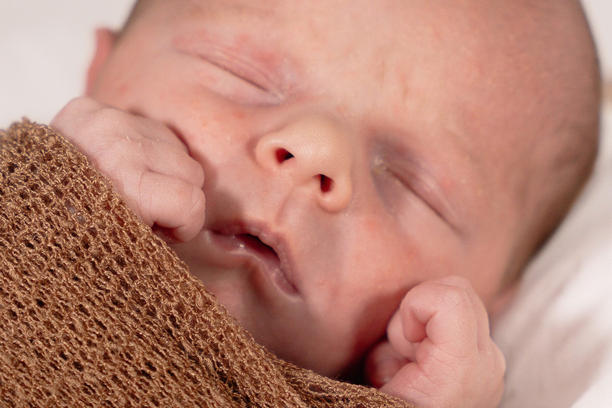 Close up of sleeping newborn baby's face