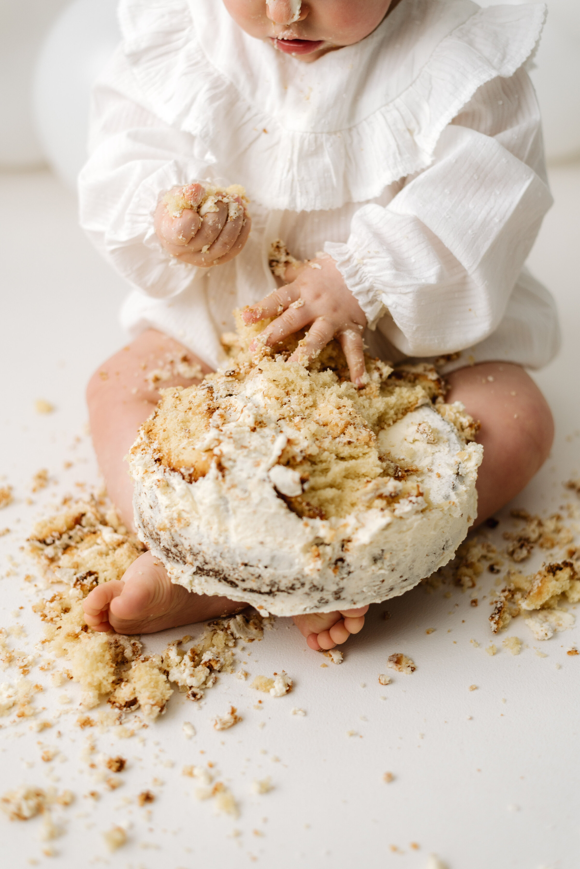 A semi-naked cake being used in a cake smash photoshoot in Billingshurst