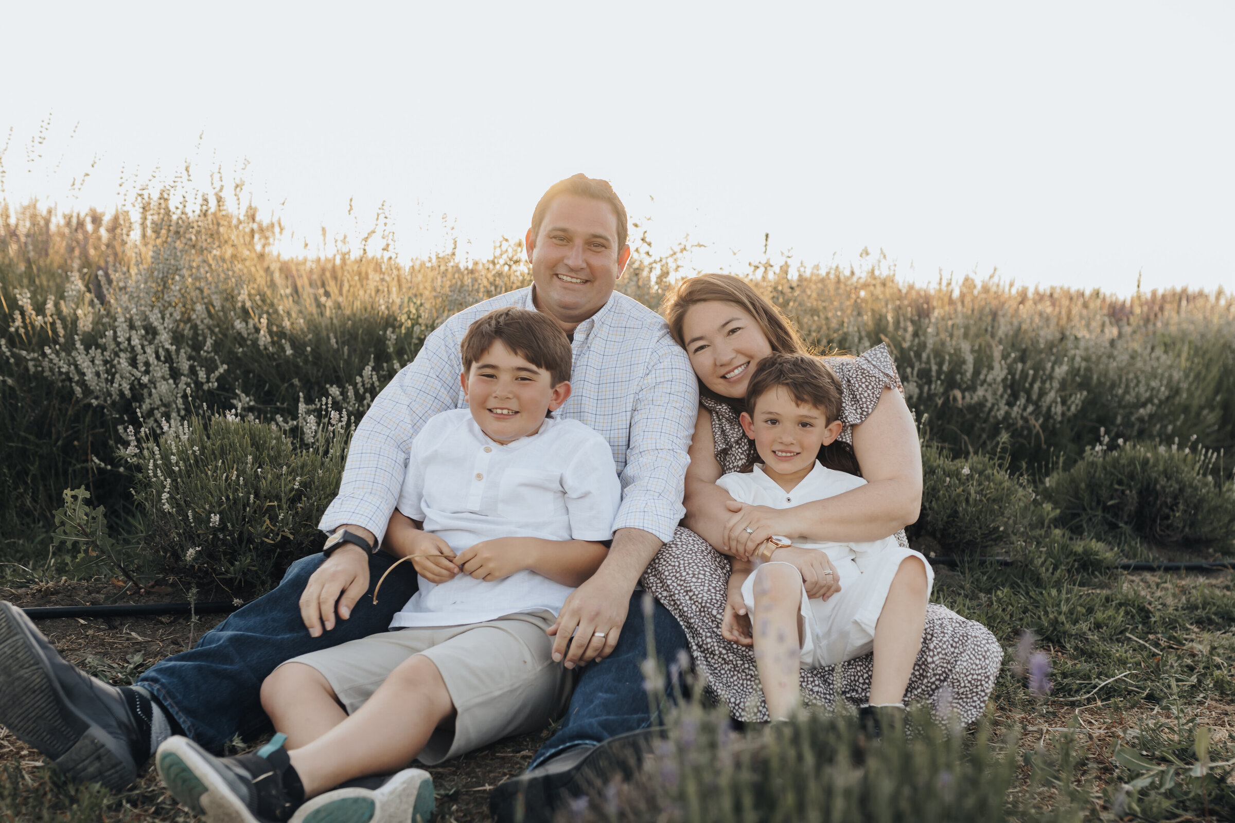 Family snuggles in the lavender fields