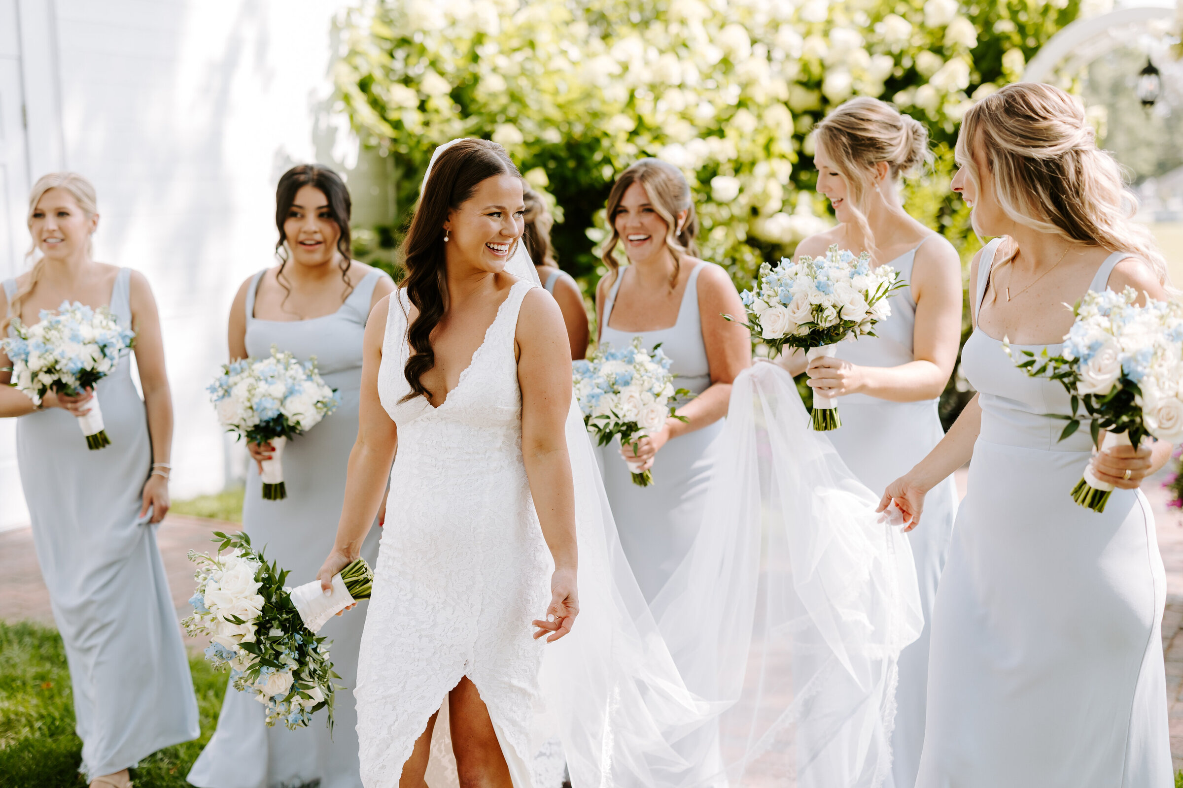 Bride walks with her bridesmaids prior to wedding ceremony at The Commons 1854 in Boston, Massachusetts