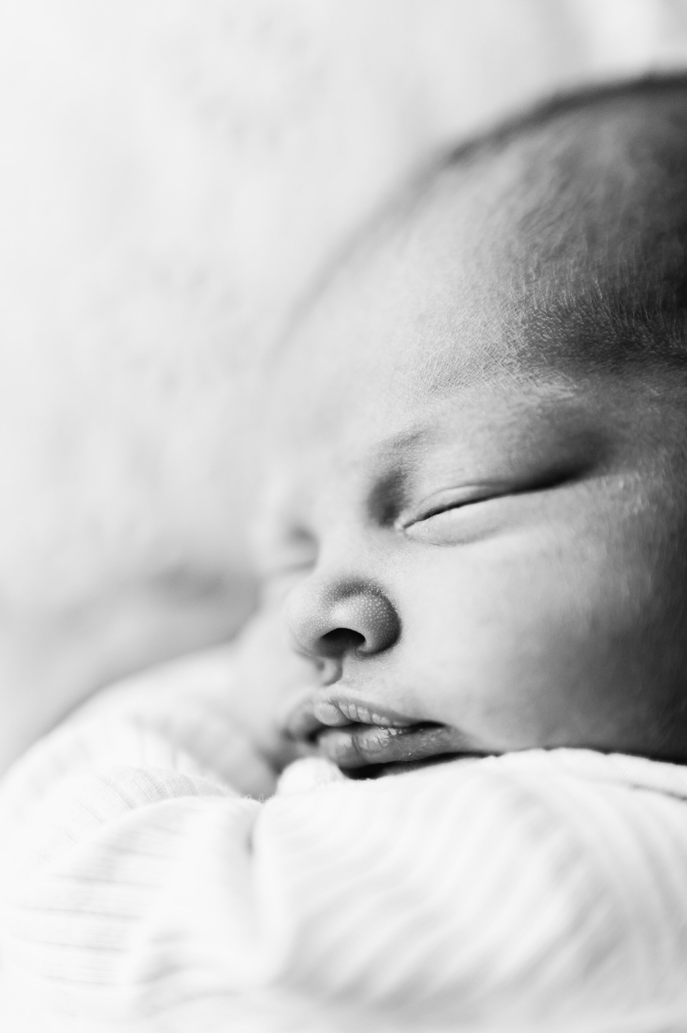 Close up photo of a newborn sleeping at Billingshurst newborn photoshoot