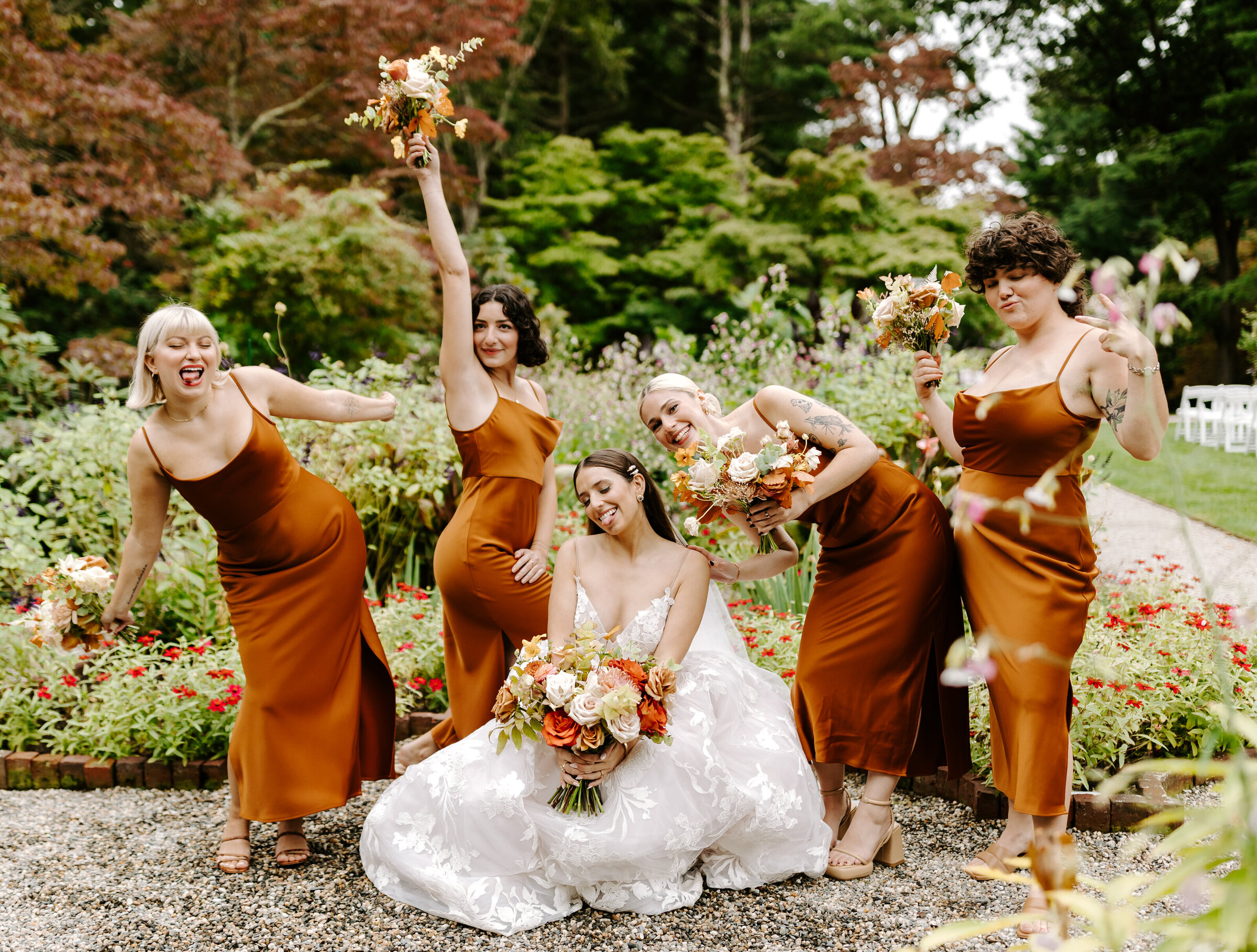 Bride and her bridal party strike a pose at The Bradley Estate in Canton, Massachusetts