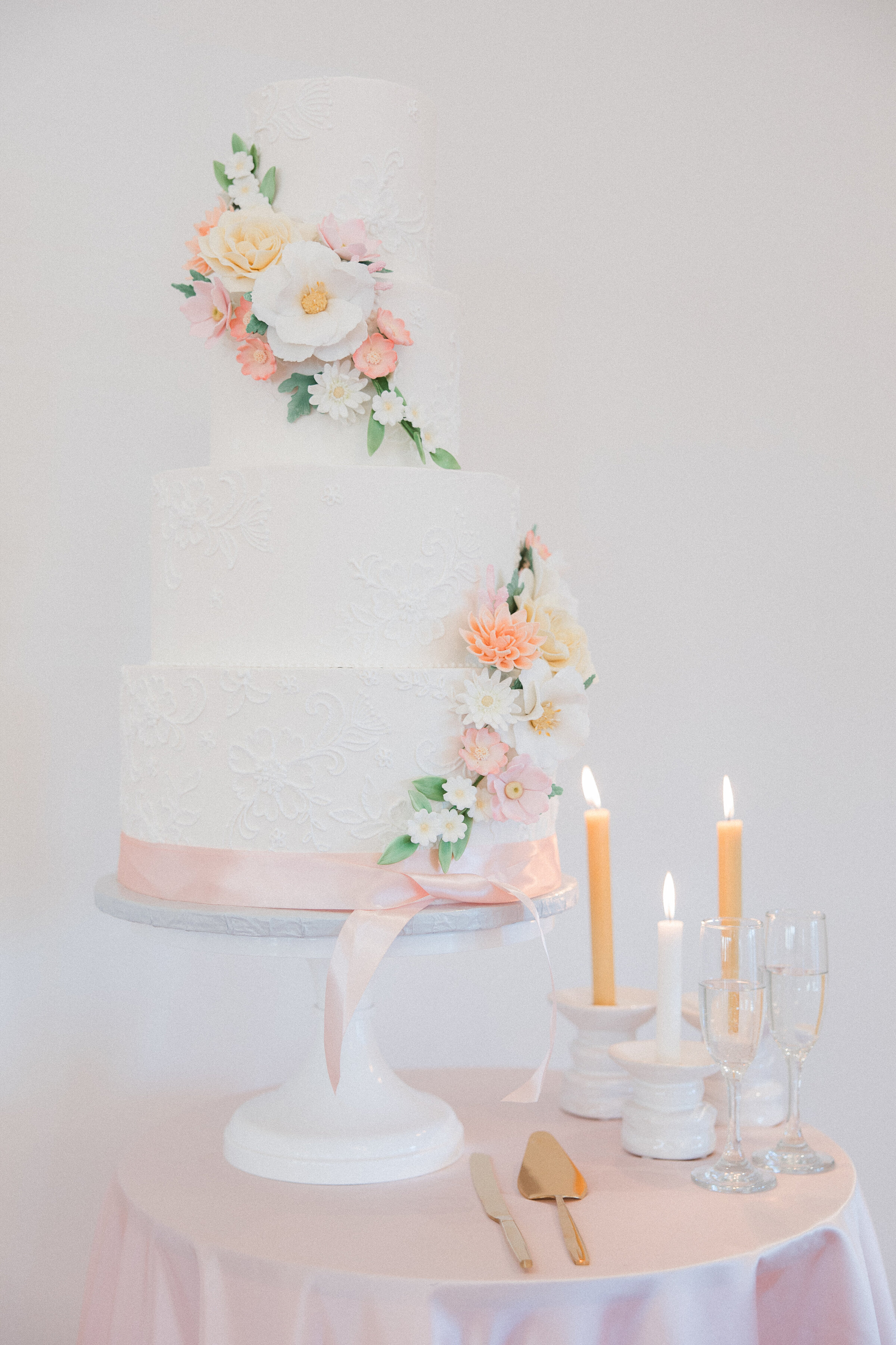 wedding cake with florals on it