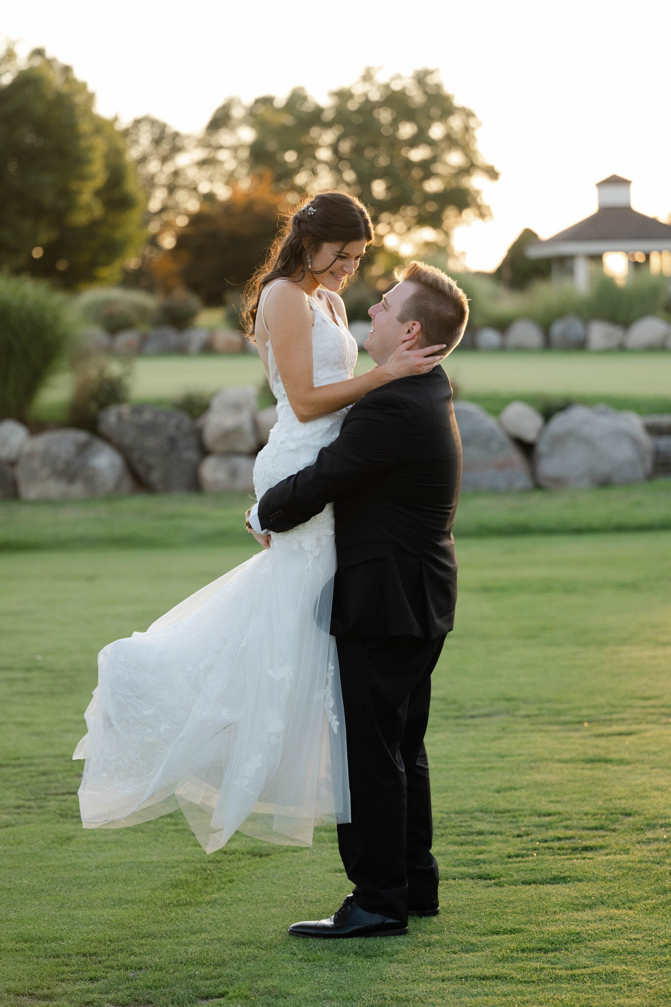 A couple at golden hour on their wedding day at The Union Pavilion at Railside