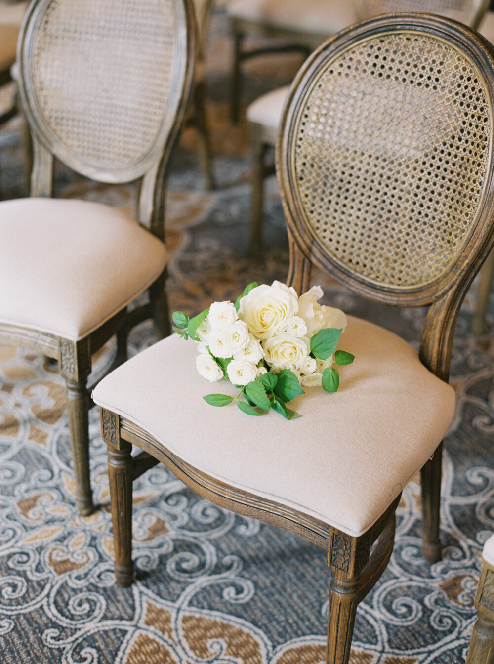 historic seattle wedding venue the rainier club ceremony in the heritage room with wooden chairs