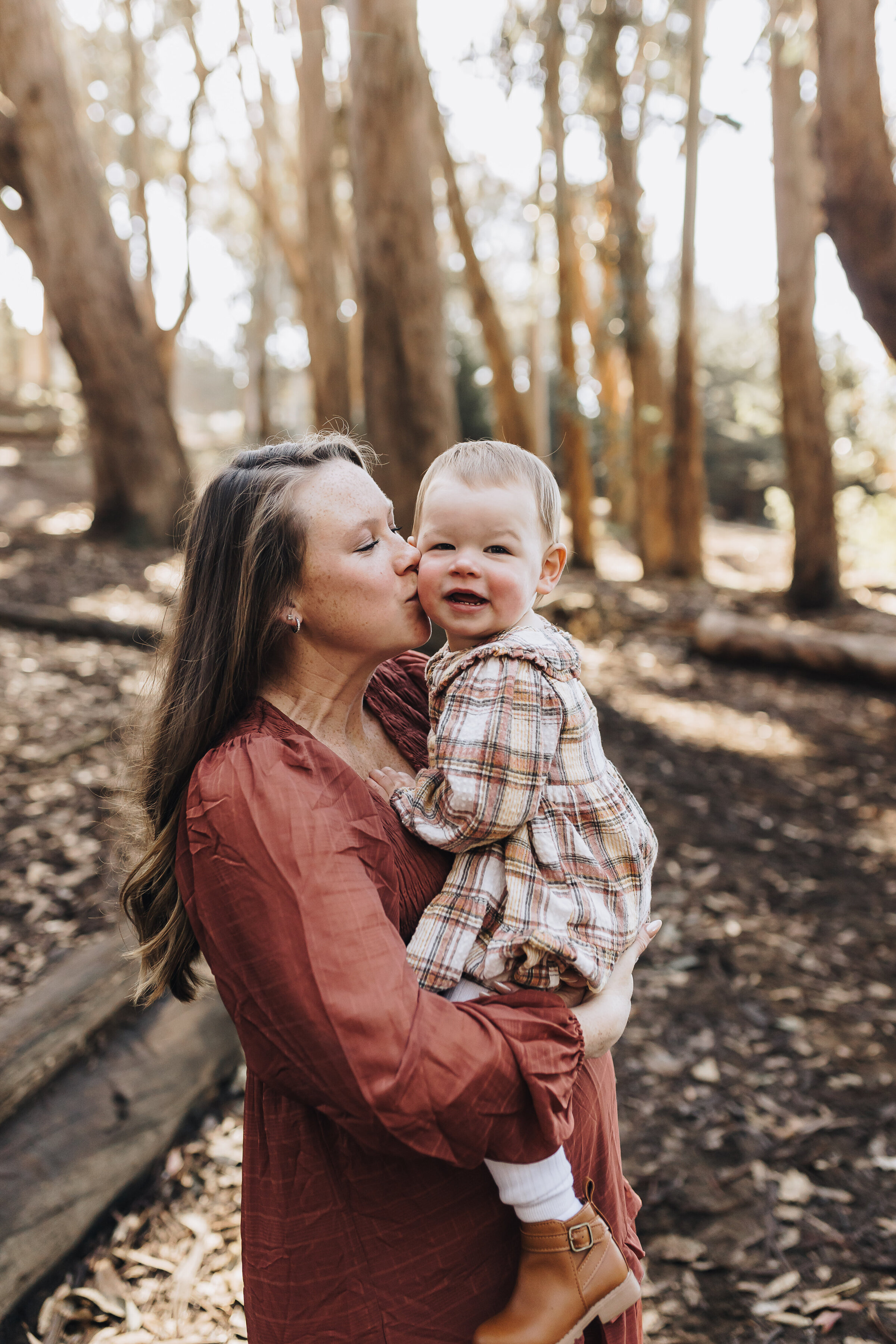 Pregnant mom holds her toddler