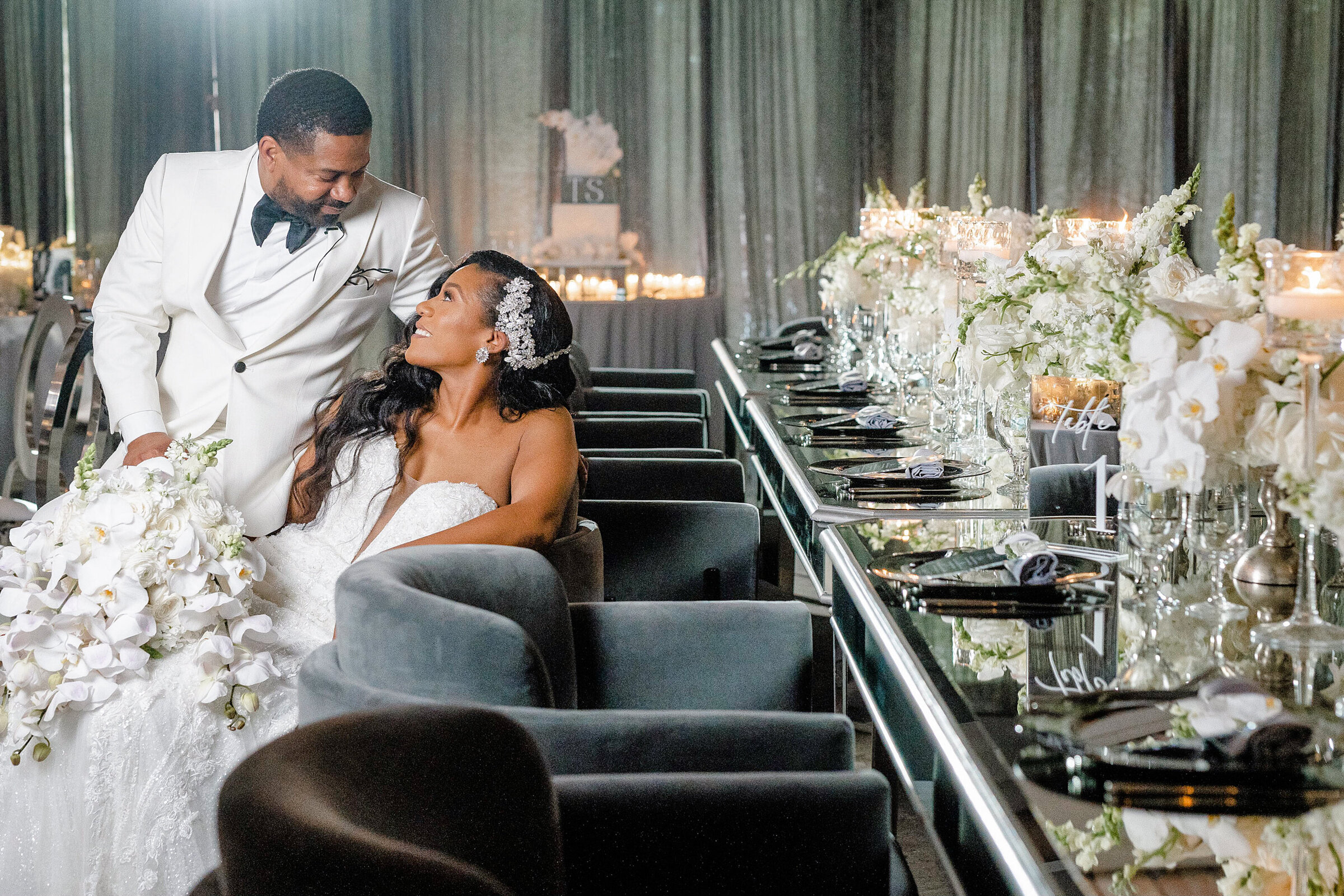 Elegant gray and white wedding reception decor with luxury floral centerpieces by Wells Design Co.