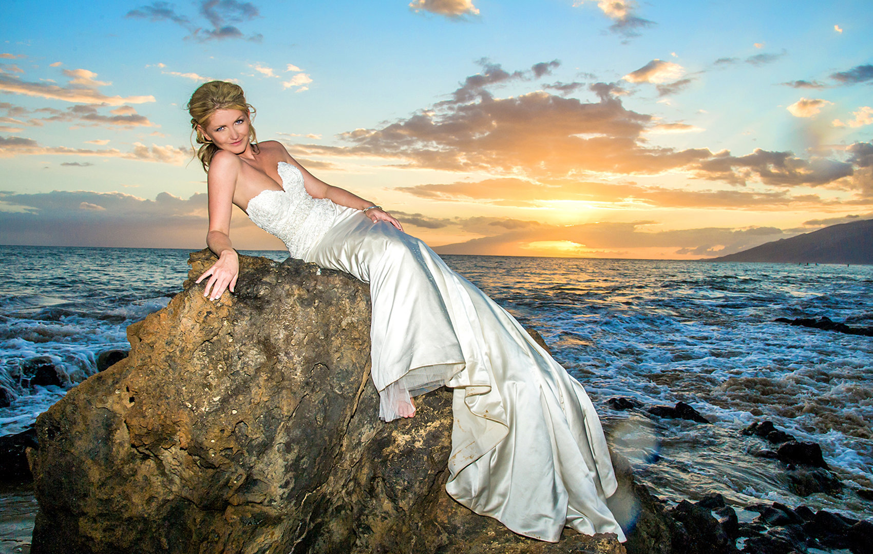bride on the rocks for a Maui sunset.