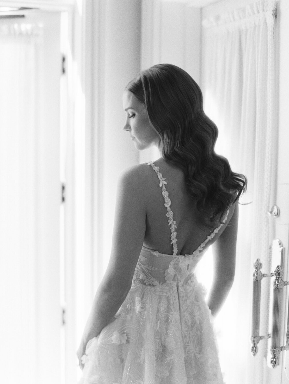 black and white film photo of brides profile from behind